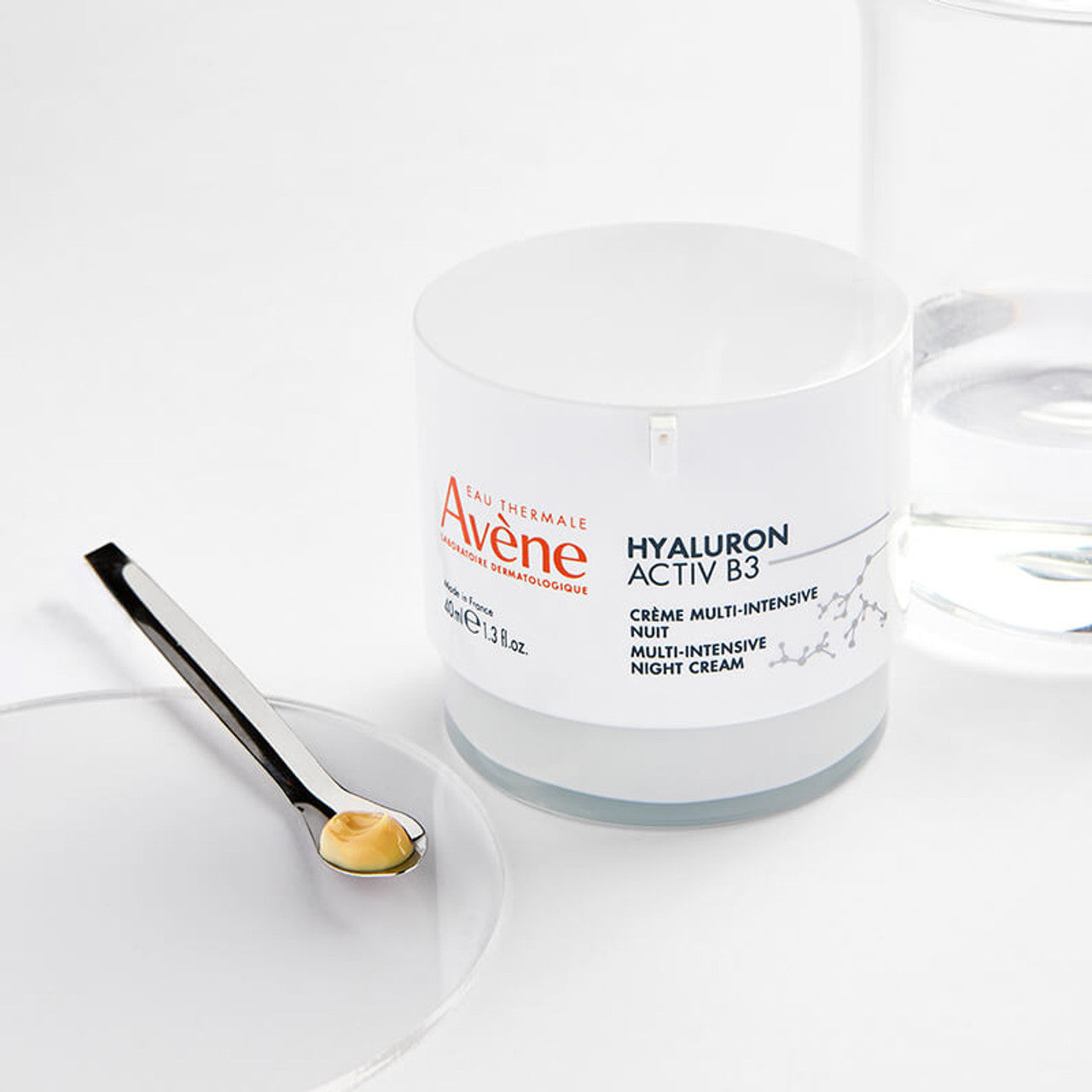 Avène Hyaluron Activ B3 Night Cream placed on a bedside table with soft lighting
