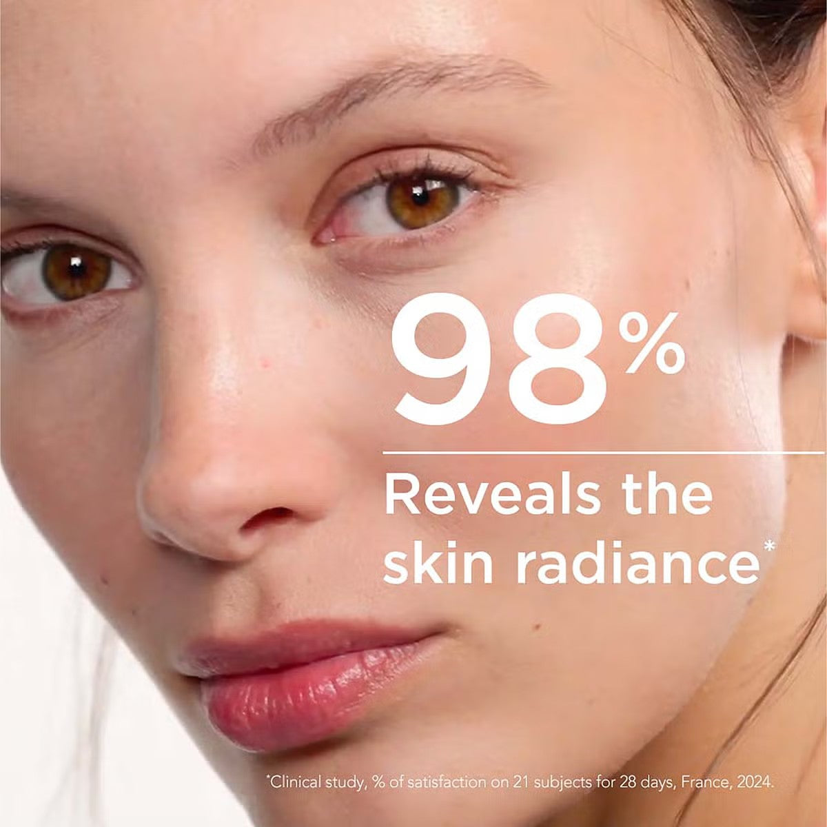 Close-up of a model with glowing skin and "98% reveals skin radiance" from clinical study