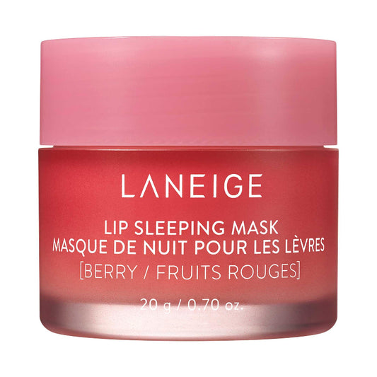 
Small pink jar of LANEIGE Lip Sleeping Mask Berry (20 g) surrounded by fresh berries, with whipped balm visible in the open lid.
